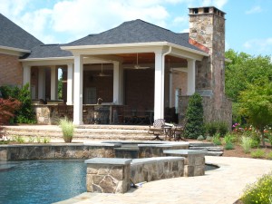 Swimming pool with masonry walls and falls